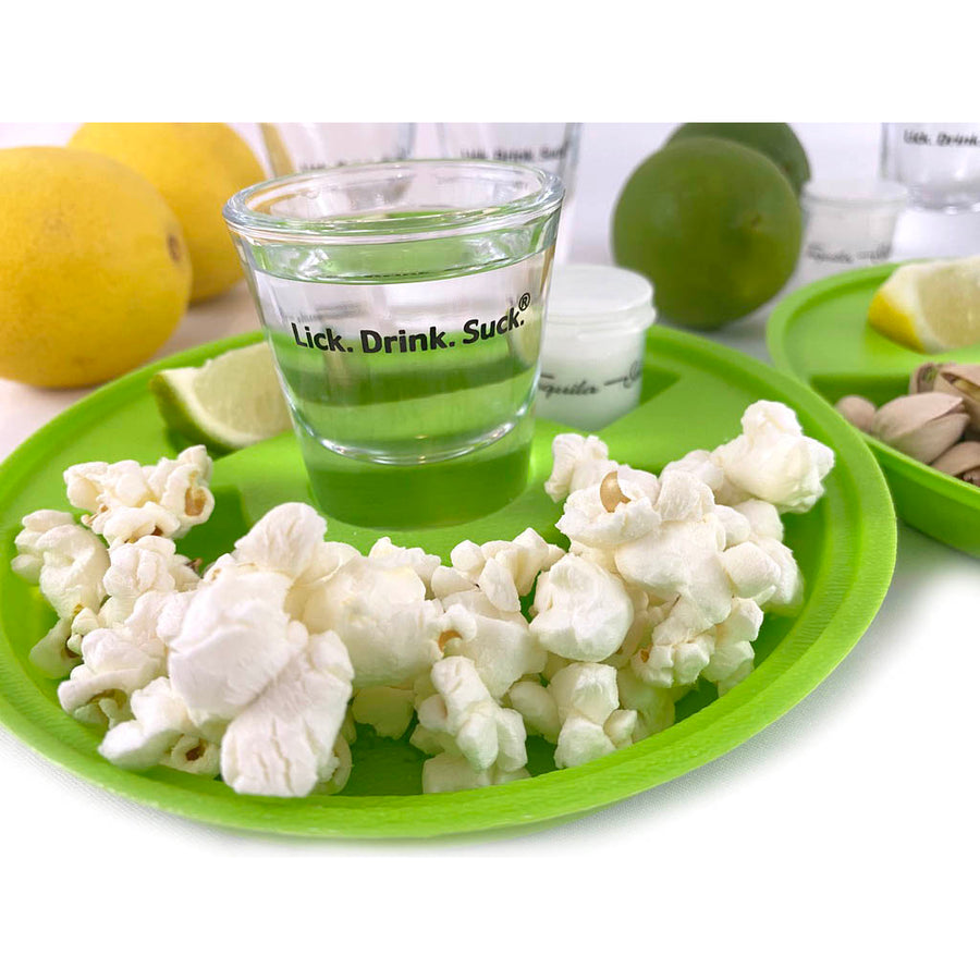 Keep your tequila shot glass, salt, and snacks in one personal drinking space with Lick. Drink. Suck.® shot-of-tequila saucers.